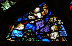 La ventana rosa oeste que representa una escena del Libro de Apocalipsis: recolección de las uvas con la hoz (14:17-18) de French School