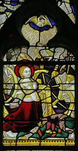 Vidriera que representa a Santa Catalina rezando y ángeles rompiendo la rueda arrojando piedras, 1460-70 de French School