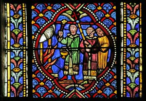 Vidriera que representa una escena de la vida de San Artheme: Un incendio en la ciudad de Clermont requiere el traslado de las reliquias del santo. Una procesión lleva el relicario y llega al incendio de French School
