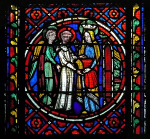 Ventana s1-C un ángel empuja al San Bonnet vestido hacia la Virgen. Ella le da una casulla roja para celebrar la Misa para ella de French School