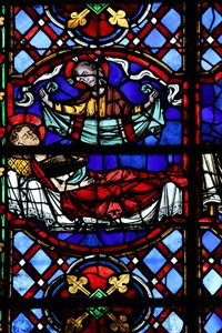 Ventana w04 que representa la Caridad de San Martín: divide su capa y esta es devuelta por Cristo