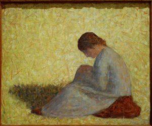 Campesina sentada en la hierba de Georges Seurat