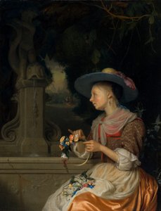 Mujer tejiendo una corona de flores