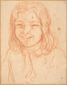 Un niño sonriente con cabello suelto