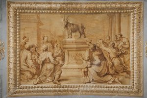 Relieve dorado de imitación, con la cabra colocada en el altar historiado y rodeada de personajes en adoración.