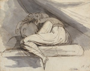 Mujer sentada, acurrucada