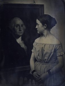 Niña con retrato de George Washington