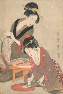 Mujeres preparando sashimi