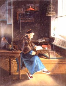 Un chino leyendo en su estudio