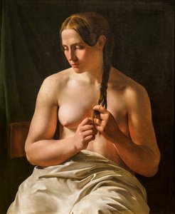 Una mujer peinándose