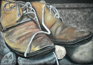 Botas viejas sobre las rocas de Marchelle de Kock