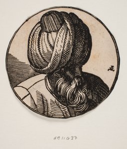 Medallón circular con el busto de un hombre con turbante y barba, visto en diagonal desde arriba, perfil 3/4 hacia la derecha