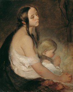 Madre con niño bajo el crucifijo
