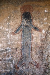 Pintura rupestre aborigen, figura de mujer (tiliqua?), en Uluru (o Ayers Rock), en el Territorio del Norte, en el centro de Australia de Prehistoric Prehistoric