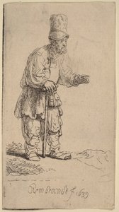 Un campesino con gorro de pico alto, de pie y apoyado en un bastón de Rembrandt van Rijn