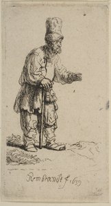 Un campesino con un gorro alto, de pie apoyado en un bastón, 1639 de Rembrandt van Rijn