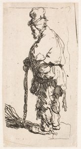 Mendigo apoyado en un bastón, mirando hacia la izquierda de Rembrandt van Rijn