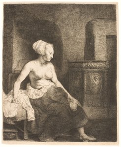 Mujer sentada medio vestida junto a una estufa de Rembrandt van Rijn