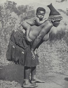 Mujer llevando a su bebé en la espalda, Sudáfrica