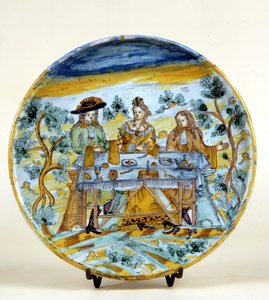 Representación de un banquete al aire libre en un plato de cerámica de Talavera de la Reina (España). Principios del siglo XVI. Milán, Museo del Castello. de Spanish School