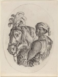 Mozo negro con un caballo árabe