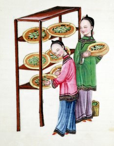 Mujeres alimentando gusanos de seda con hojas de morera