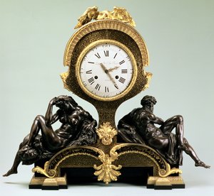 Reloj de sobremesa con figuras de Día y Noche de Unbekannt