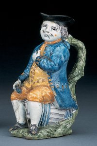 Jarra Toby con cara y manos de manganeso pálido, sosteniendo una jarra globular vacía de color buff en chaqueta y calzones azules lavados, y chaleco verde, c.1800 de Unbekannt