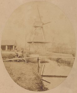 [Pintor con sombrero en el caballete pintando un molino de viento] de Unknown artist
