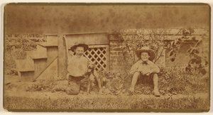 [Dos chicos sentados en el suelo con un perro] de Unknown artist