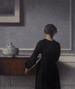Interior con joven de espaldas de Vilhelm Hammershøi