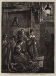 Vida en Londres en el East End, fabricación de sacos a la luz de una lámpara de calle de William Bazett Murray