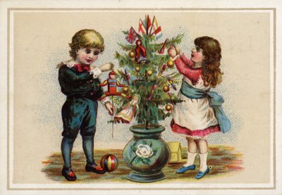 Niños decorando un pequeño árbol de Navidad de American School