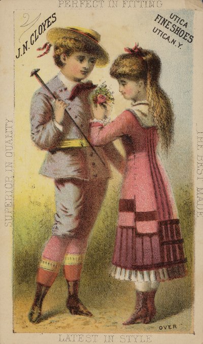 Niña colocando ojal en la chaqueta de un niño de American School