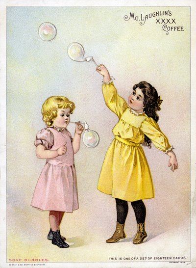 Niñas soplando burbujas de American School
