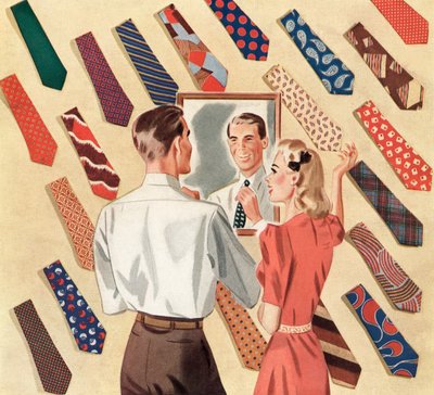 Un hombre se endereza la corbata en el espejo en medio de un despliegue de corbatas de muchos hombres de American School