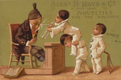 Tres niños pequeños rociando agua de American School