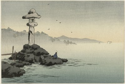Linternas en una roca en la costa de Anonymous