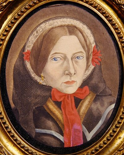 Retrato de una mujer con un sombrero y cinta roja, c.1830 de Austrian School