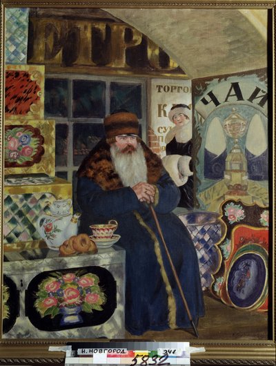 Un comerciante de cajas pintadas (A Bags Merchant). Un hombre vestido con un abrigo grueso con un amplio cuello de piel, espera cerca de su mercancía, con su tetera, con pasteles al lado. Detrás de él, en el callejón comercial, una mujer elegante sonríe. P de Boris Mikhailovich Kustodiev