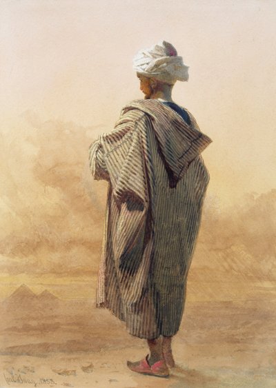 El Cairo, un árabe al anochecer frente a las pirámides de Carl Haag