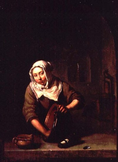 Mujer limpiando de Caspar Netscher