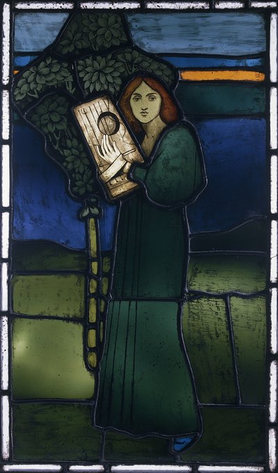 Un panel de vidrio emplomado que representa una figura femenina de cuerpo entero tocando un instrumento de cuerda de David Gauld