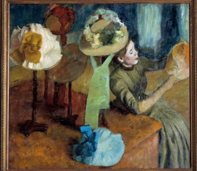 En la sombrerería (o The Millinery Shop) de Edgar Degas