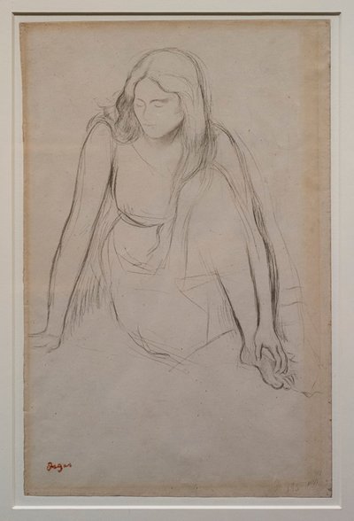 Mujer sentada al borde del agua de Edgar Degas