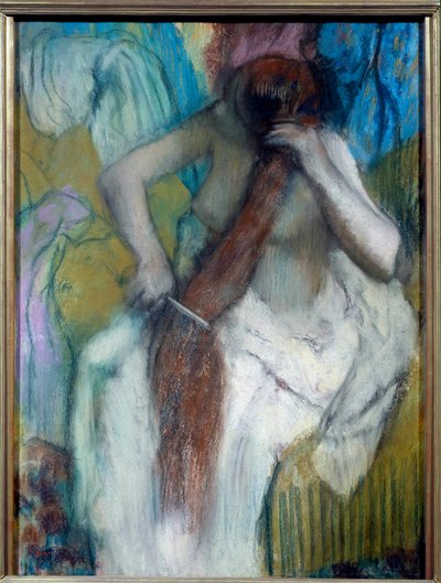Mujer peinándose de Edgar Degas