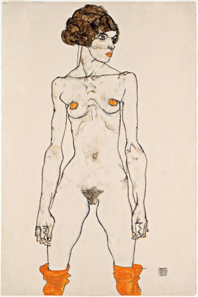 Joven desnuda de pie con medias de color naranja de Egon Schiele