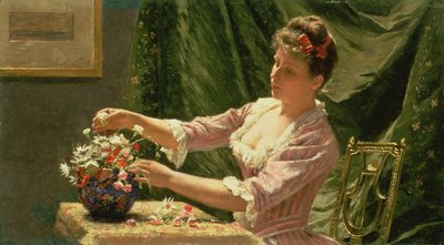Joven mujer arreglando flores de Emile Claus