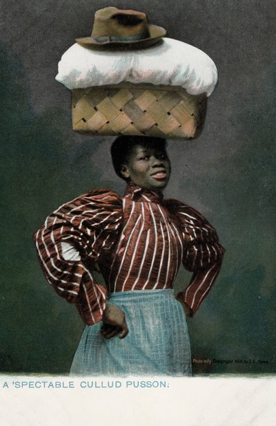 Niña negra con una cesta de ropa, coronada por un sombrero, en su cabeza de English Photographer