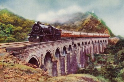 Locomotora de vapor 4-6-2 del Ferrocarril de Bombay, Baroda y la India Central transportando el Frontier Mail pasando sobre un viaducto entre Bombay y Delhi de English School